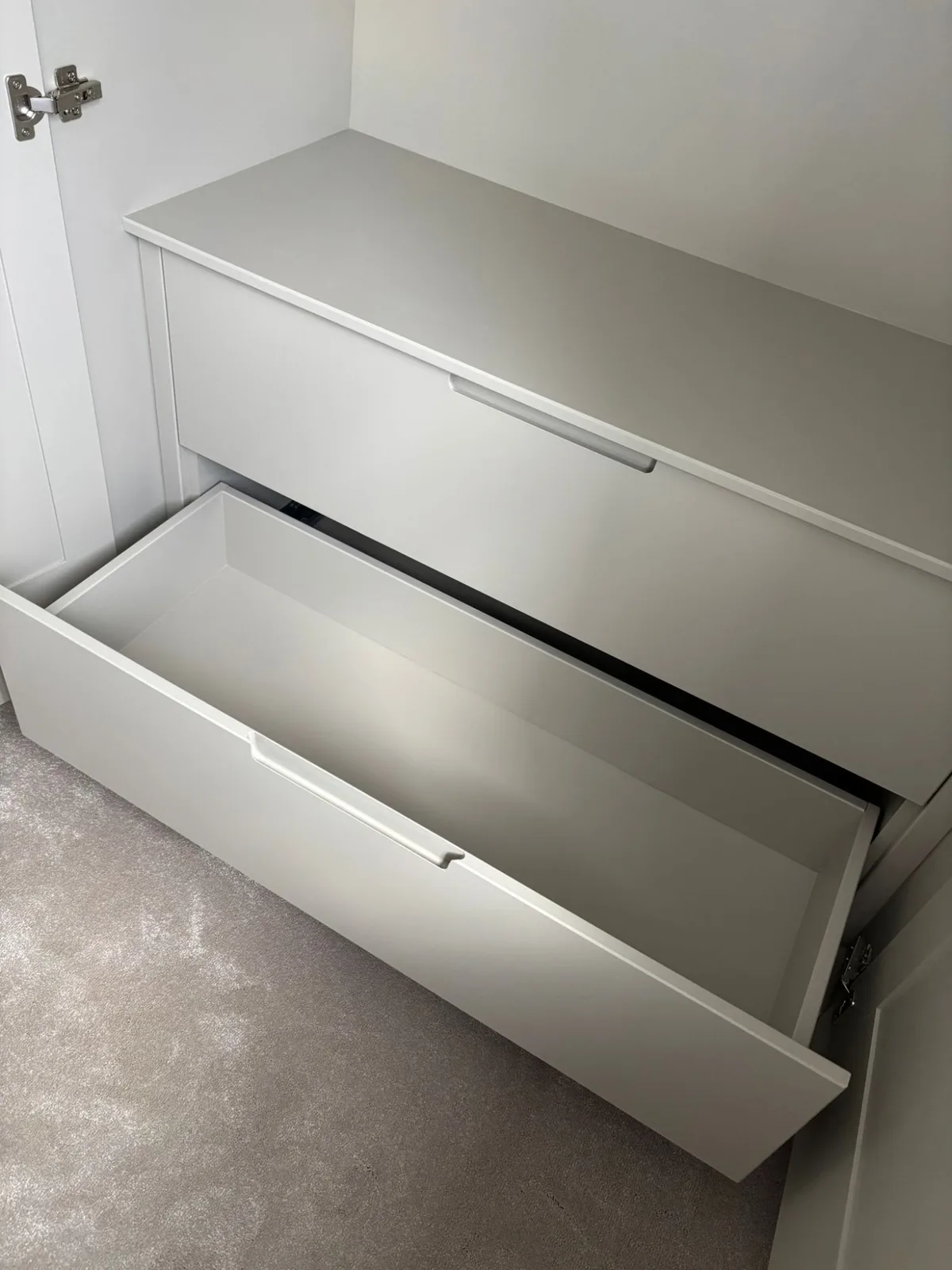 Soft-close built-in drawers inside a fitted wardrobe