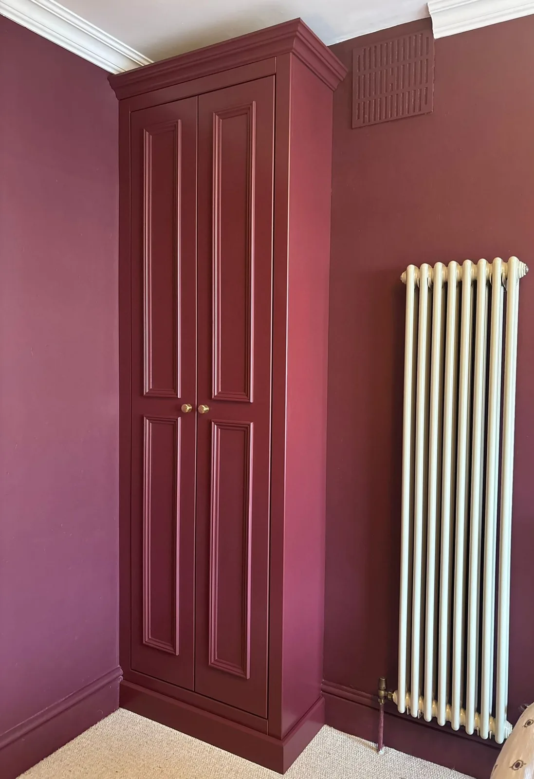 Hand-painted bespoke storage with panel detailing
